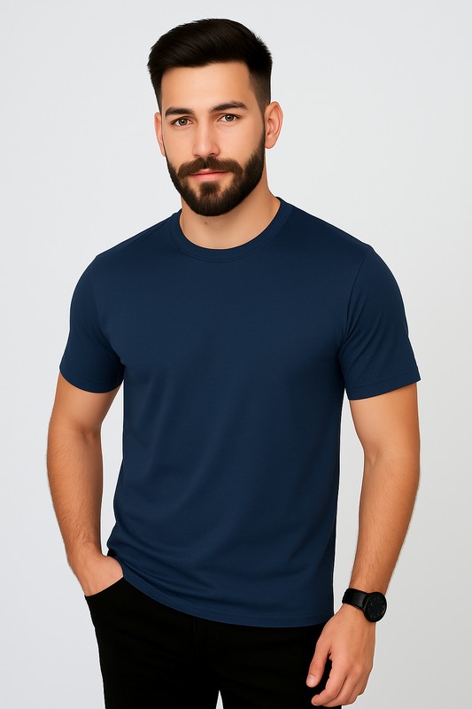 Man wearing a navy blue t-shirt against a light gray background